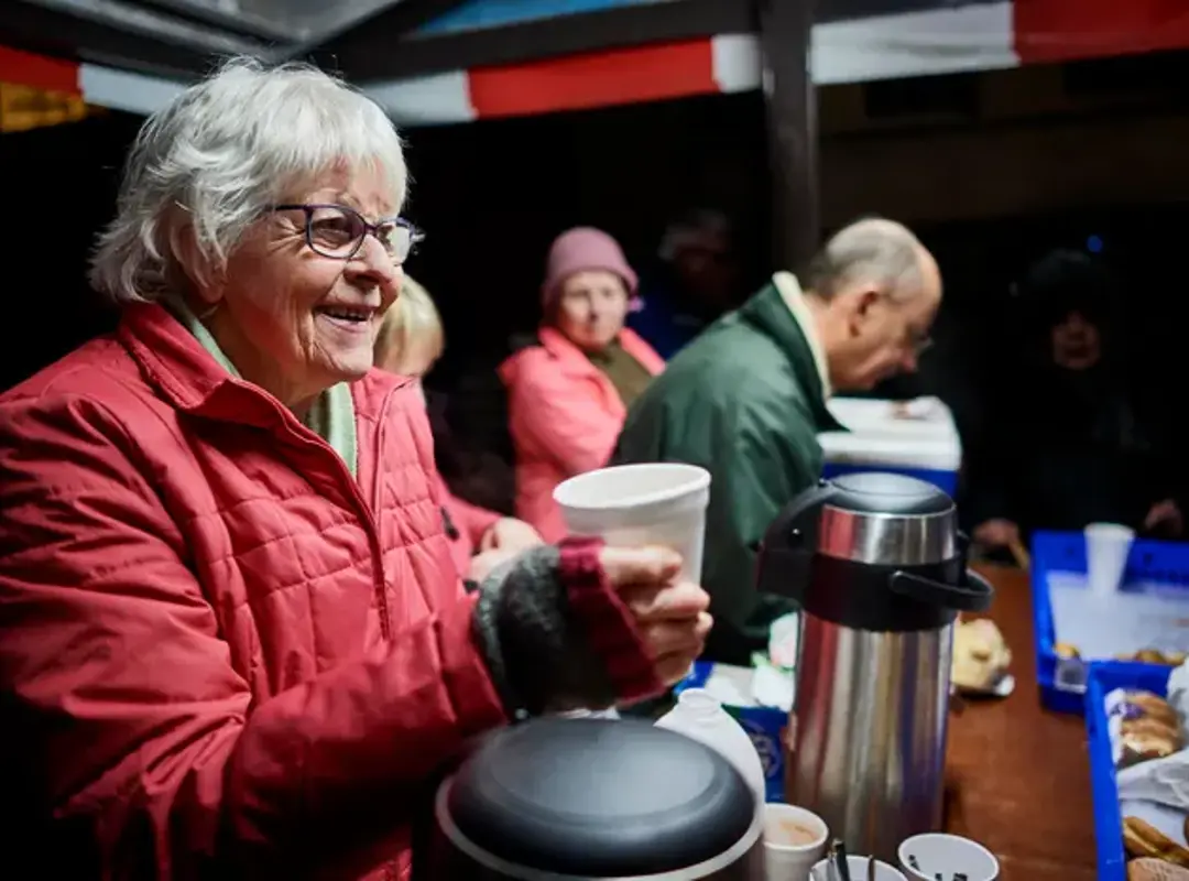 Person serving at a soup kitchen