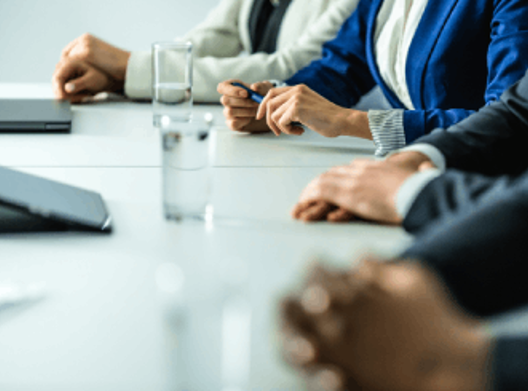 Hands On Desk In Meeting