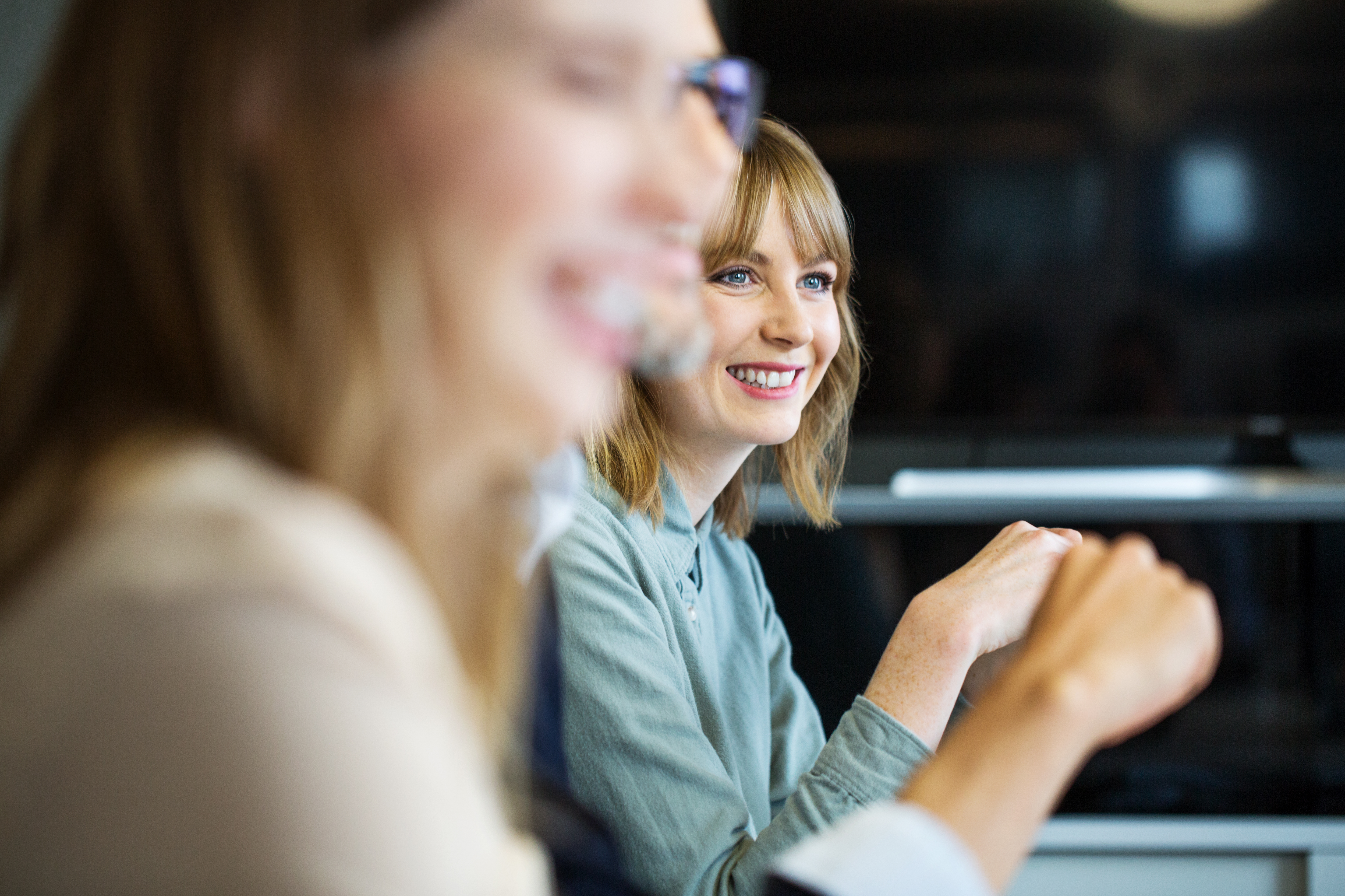 Lady in meeting smiling