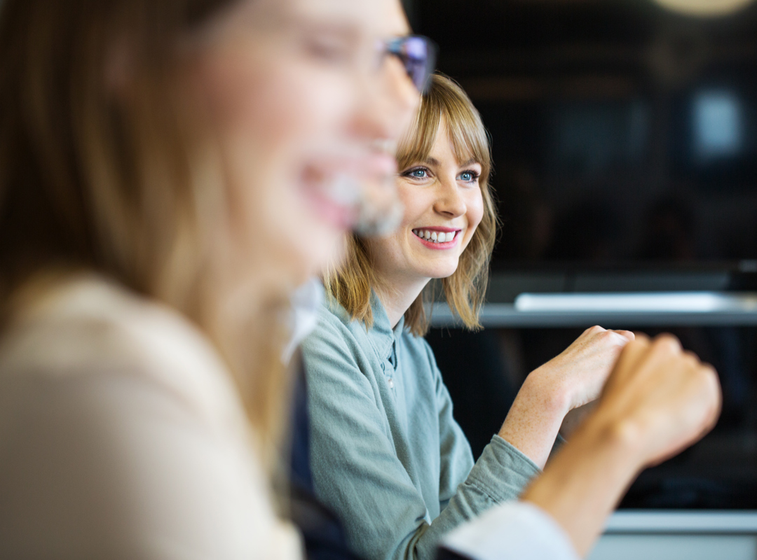 Lady in meeting smiling