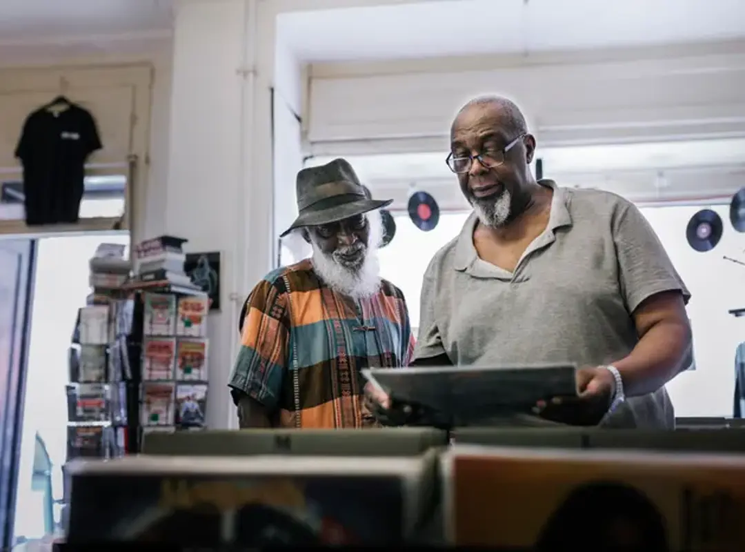 Two people browsing records